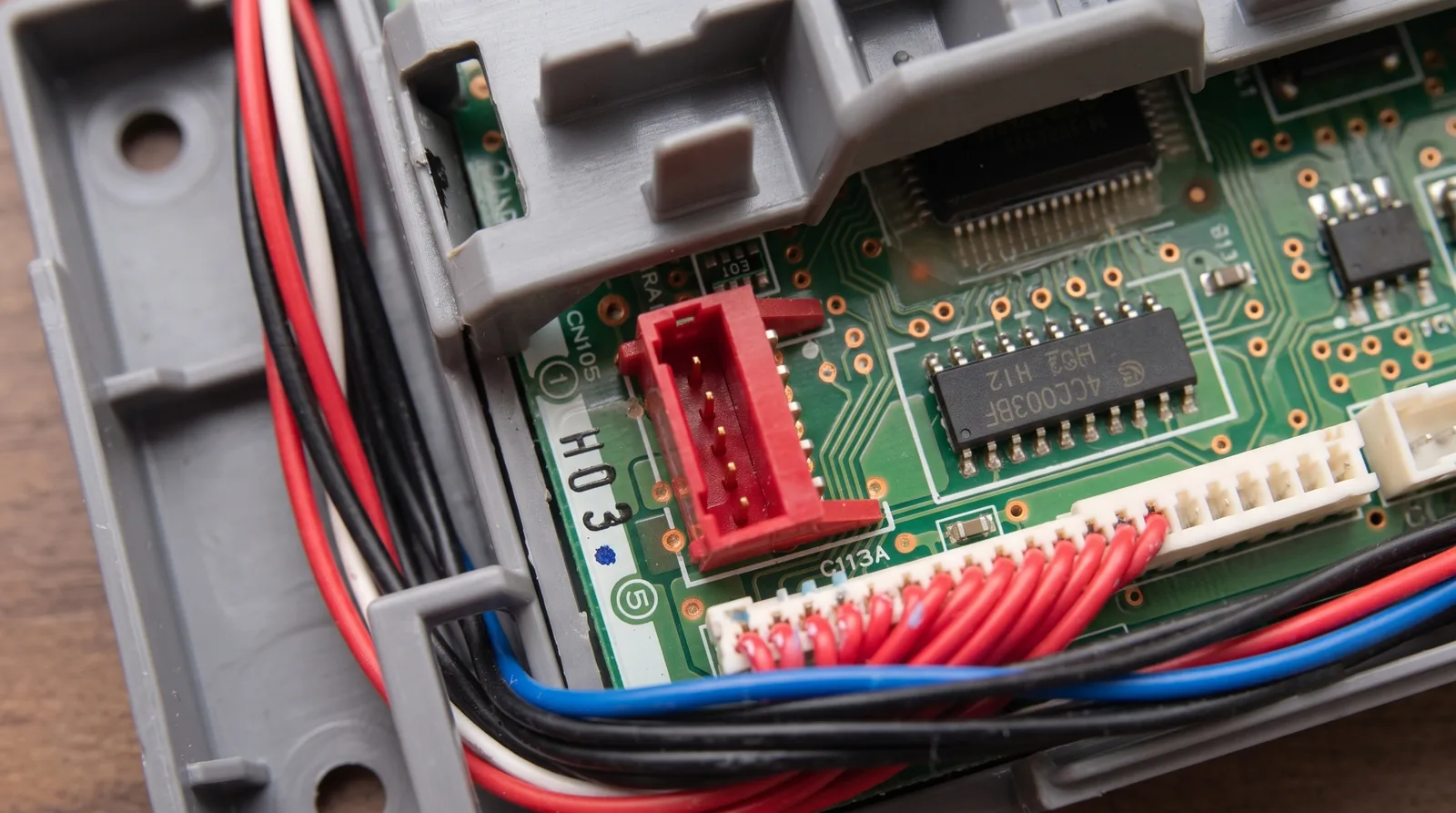 The red CN105 serial port on a Mitsubishi indoor unit's control board