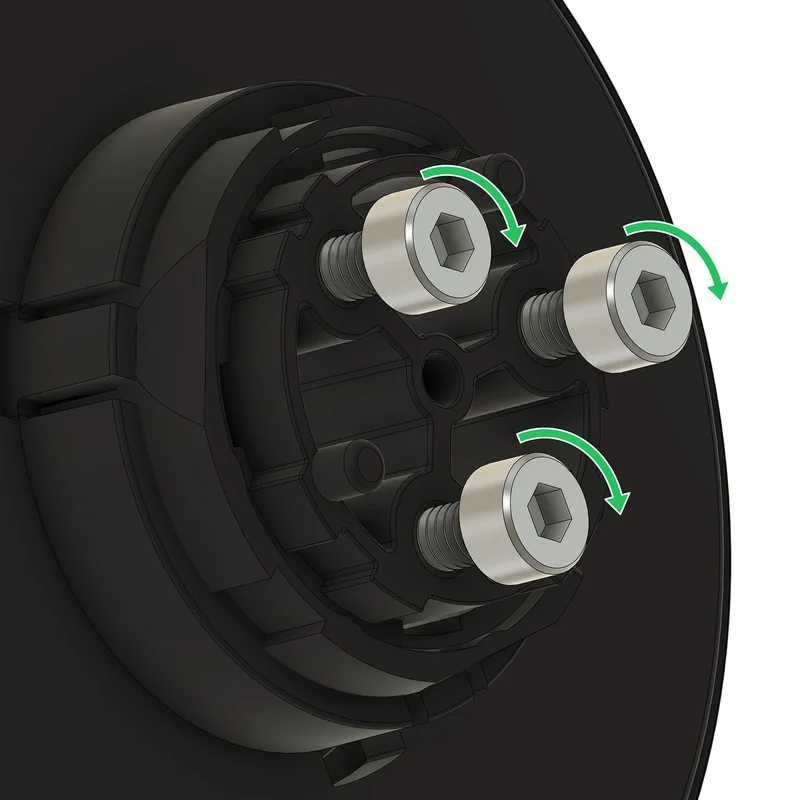 Three partly installed screws on the back of the display, with arrows showing the tightening direction