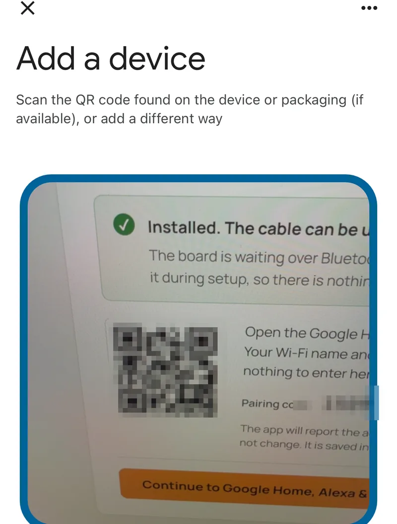 The Google Home app's Add a device screen, with the camera pointed at the pairing code shown by the browser installer