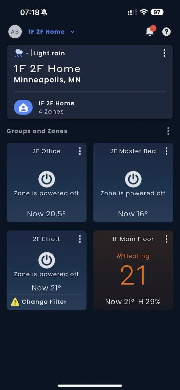 The Kumo Cloud app dashboard showing several Mitsubishi mini-split zones, one heating and the rest powered off