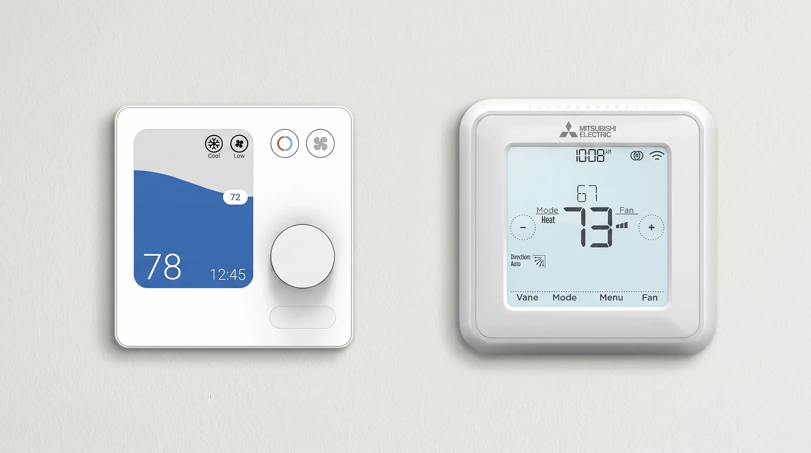 Two Mitsubishi wall controllers mounted side by side: the PAC-SDW01RC-1 wired controller with a color screen and the MHK2 with its Vane, Mode, Menu, and Fan display