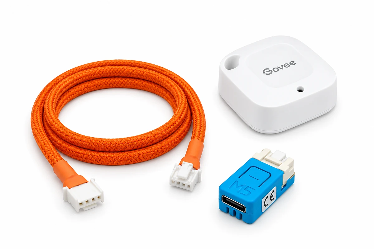 The CN105-to-Grove cable, the wireless room sensor, and the Wi-Fi controller board laid out together